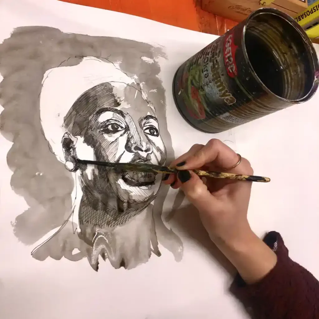 Foto von Hand, die Portrait in Tusche malt - weLOFTart - Malschule und Zeichenschule München